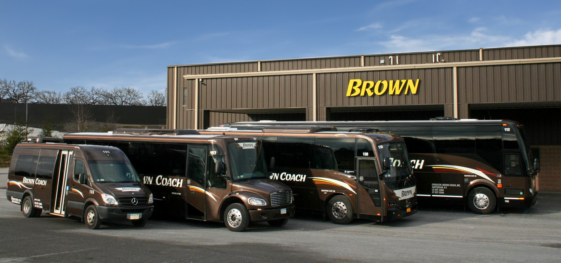 Brown Coach bus parking lot