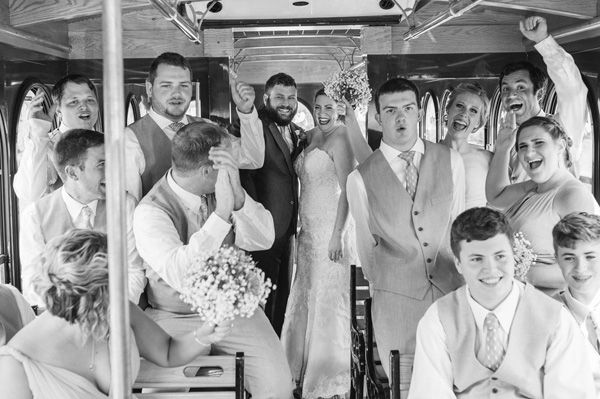 black and white image of a wedding party in a trolley